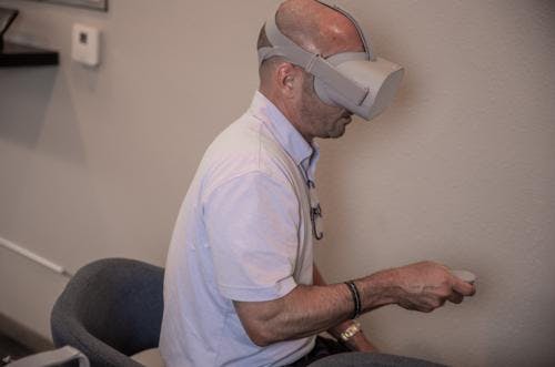 Client taking a virtual tour of a Braustin Home using a VR headset